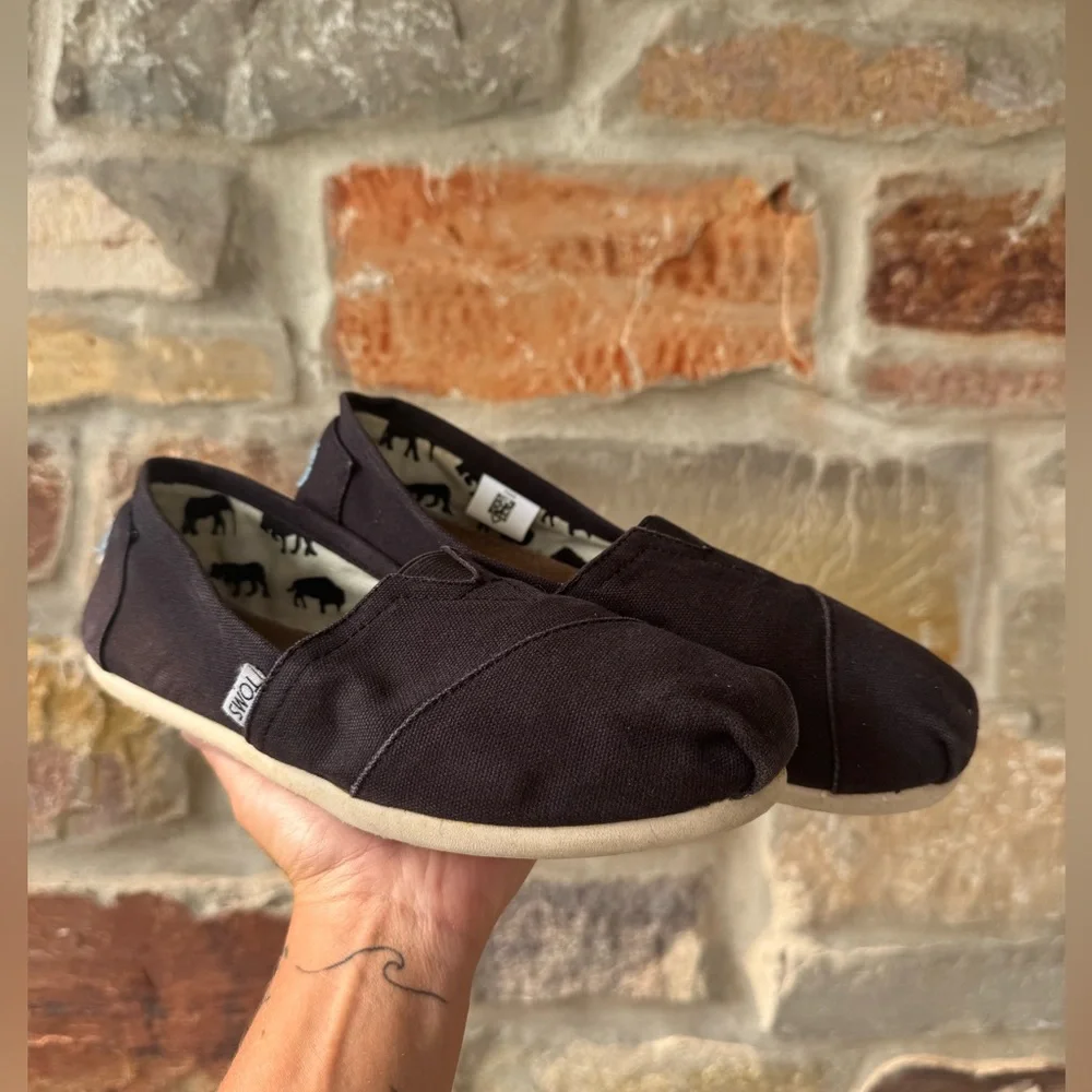 TOMS black casual slip ons